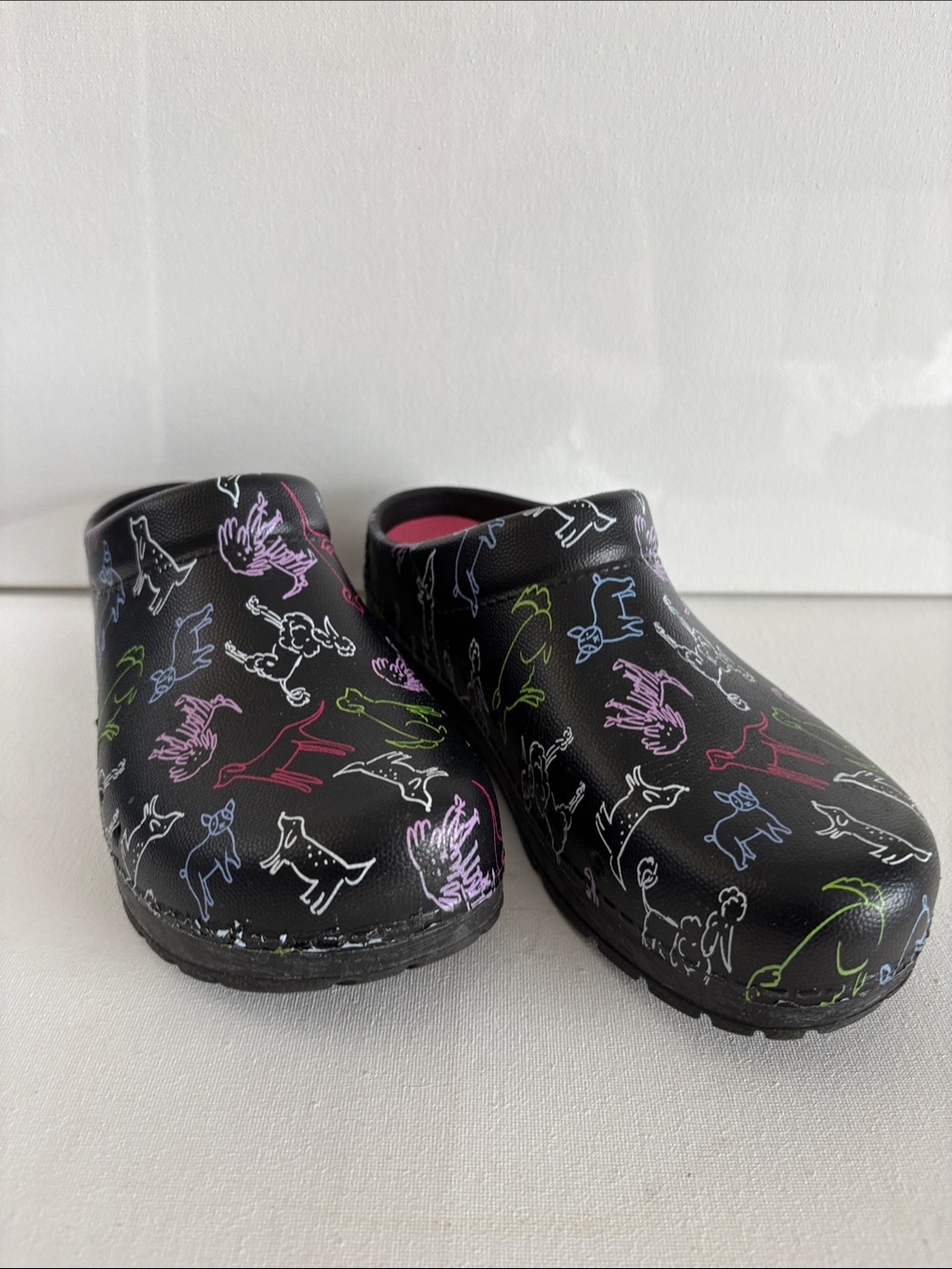 Dansko Black Clogs with Multicolor Dog Outline Print
